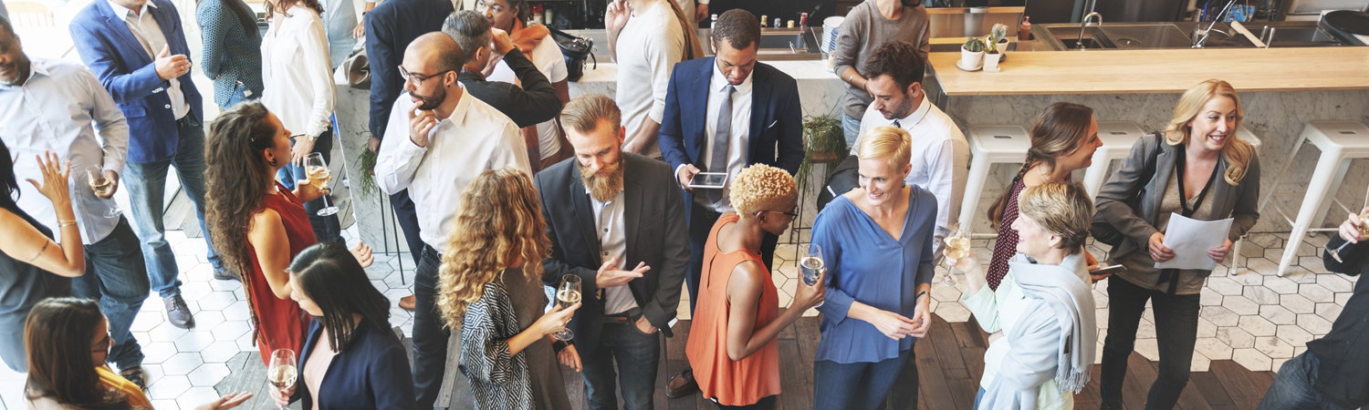 Professionals Meeting and Talking at Business Casual Event